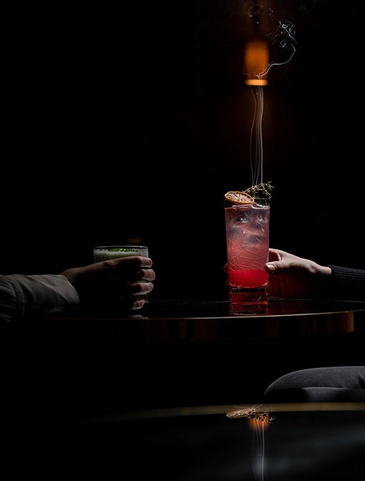 Married couple toasting to their wedding anniversary at Dans le Noir ? restaurant