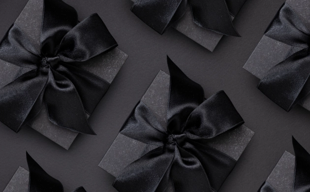 Cadeaux noirs avec ruban illustrant des cartes cadeaux Dans le Noir Marseille expériences sensorielles
