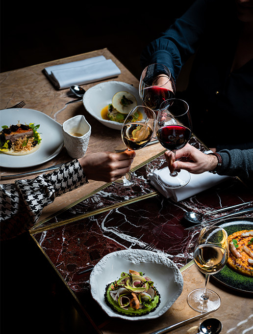 A group of guests celebrating a farewell with a gourmet dinner at Dans le Noir ? restaurant.