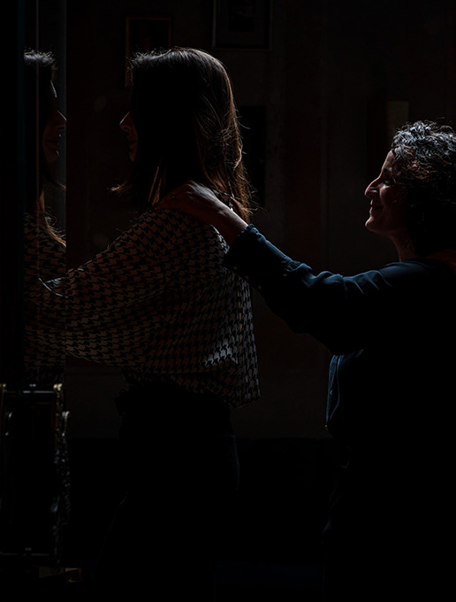 A group of young women walking in a single file, celebrating a bachelorette party at Dans le Noir ? restaurant